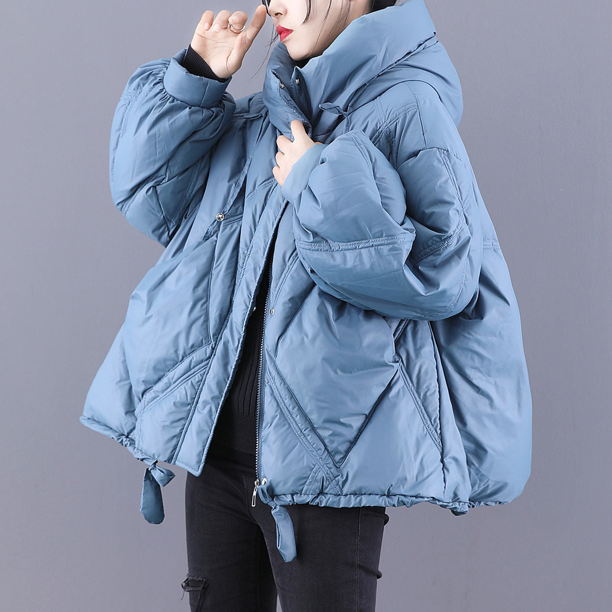 Piumino oversize con collo alto