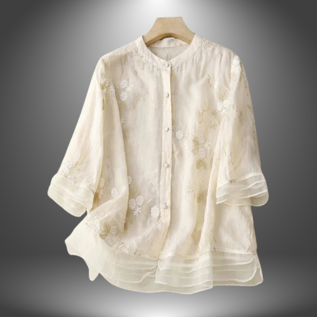 Blusa ricamata in lino con balze
