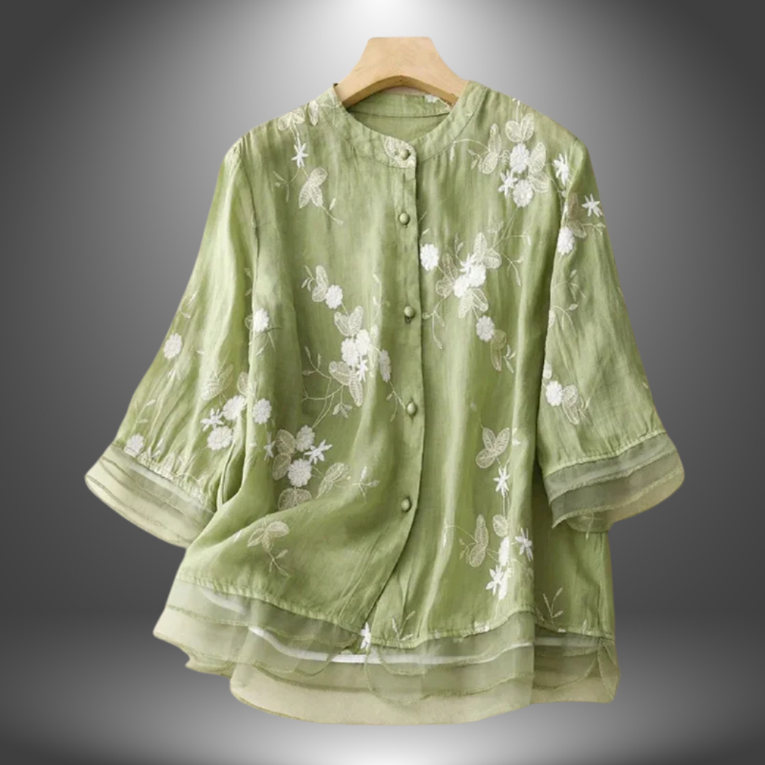 Blusa ricamata in lino con balze