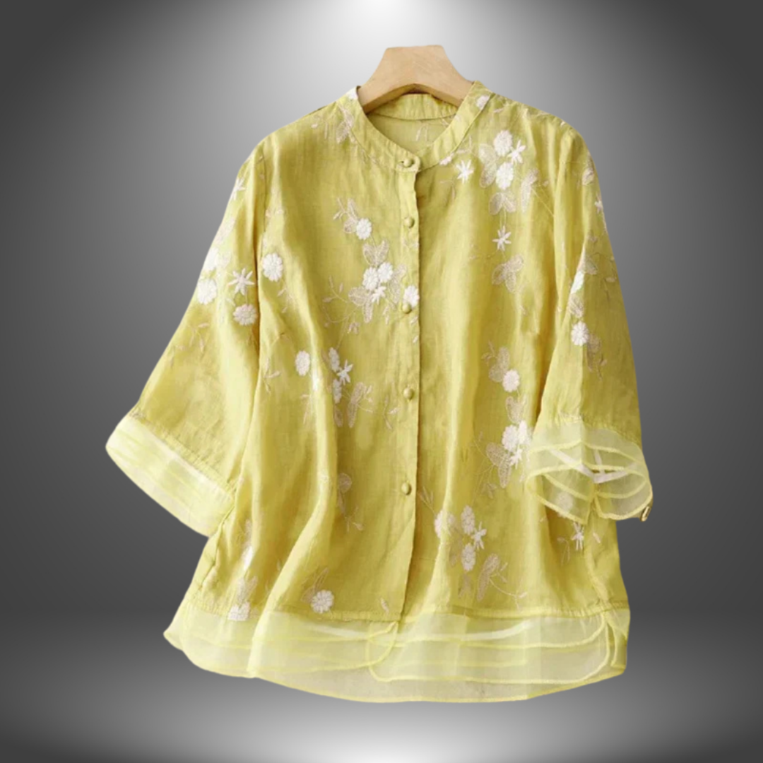 Blusa ricamata in lino con balze