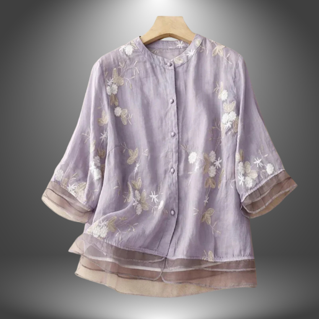 Blusa ricamata in lino con balze