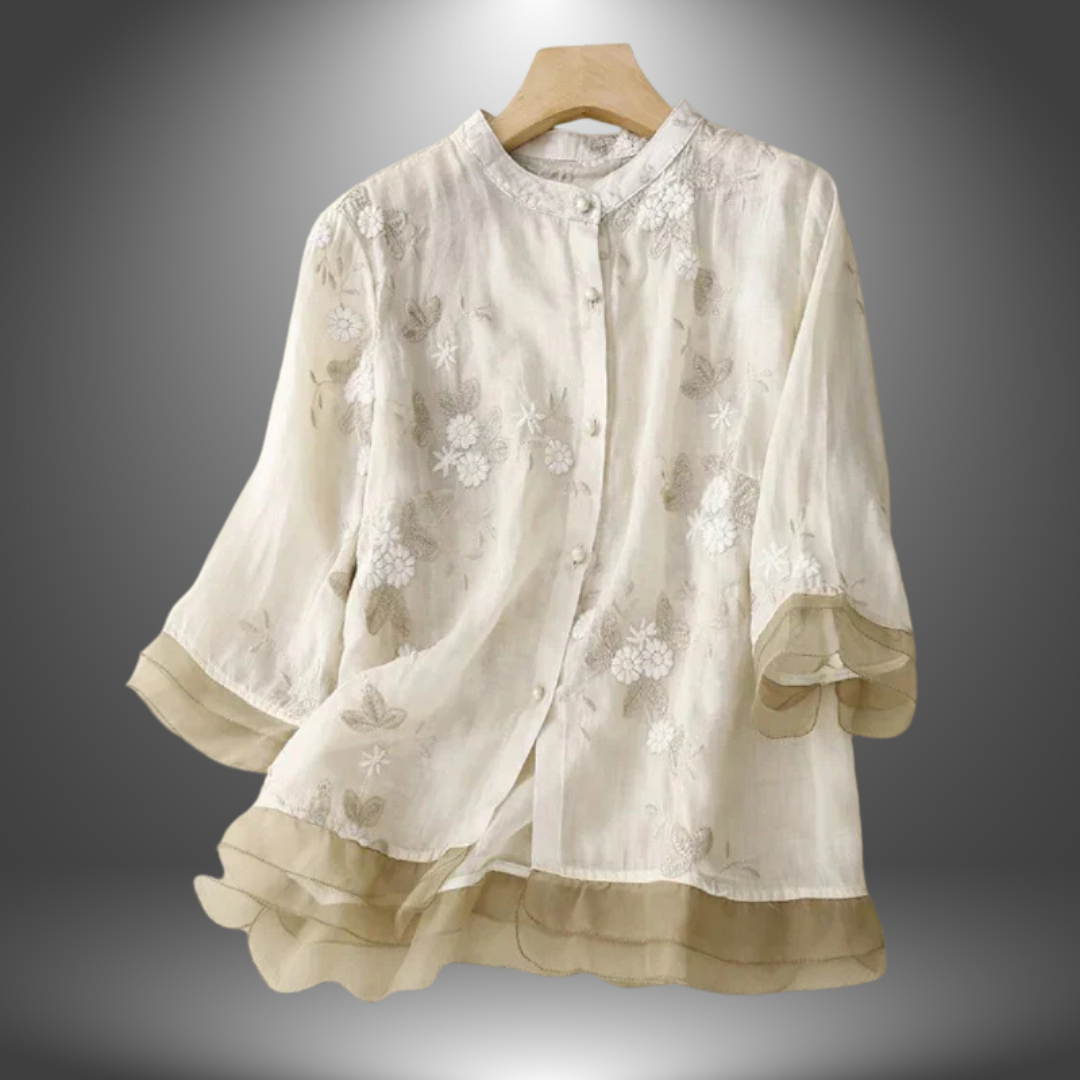 Blusa ricamata in lino con balze